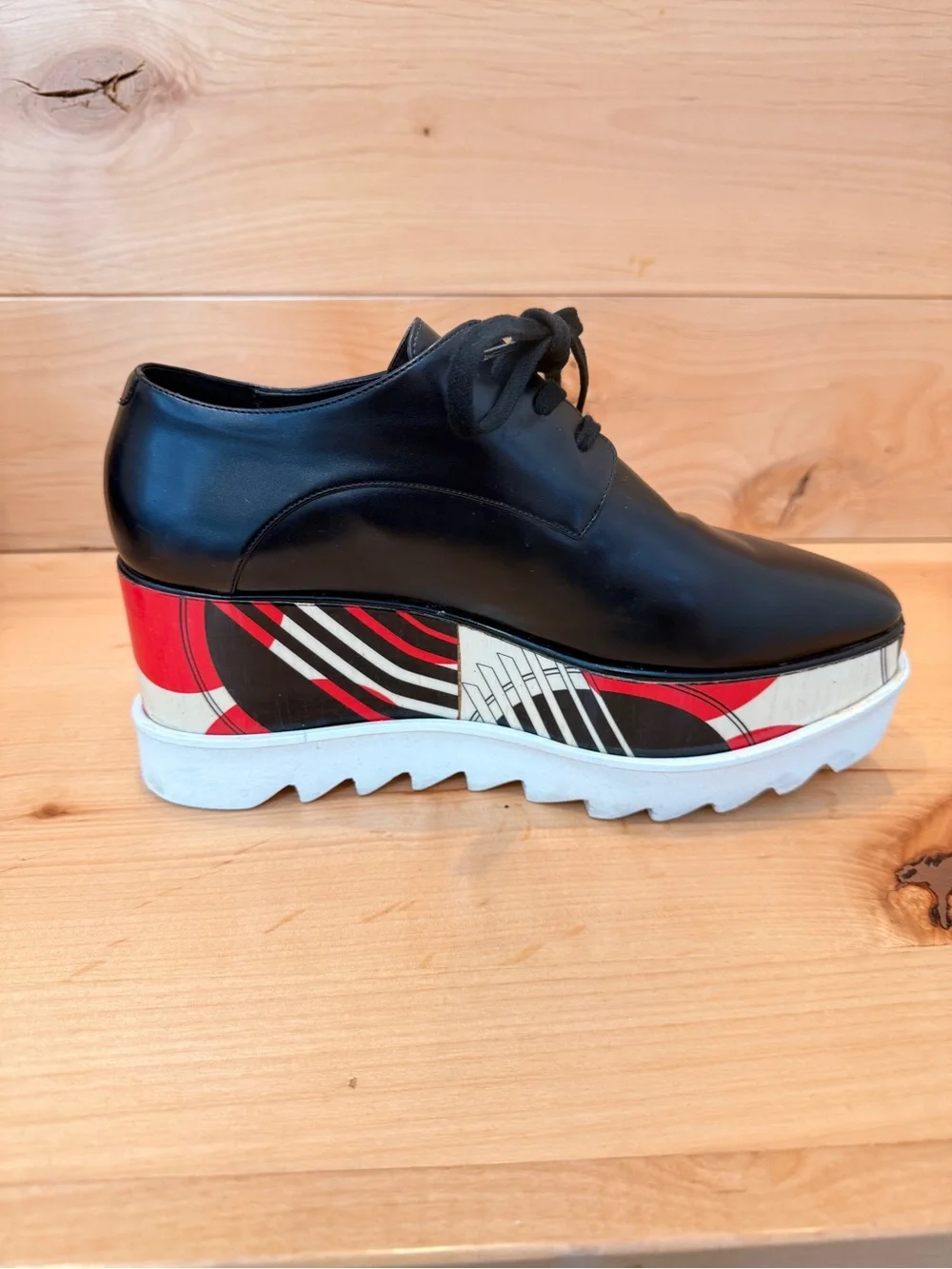 Stella McCartney Black Leather Elyse Platform Shoes with abstract design.